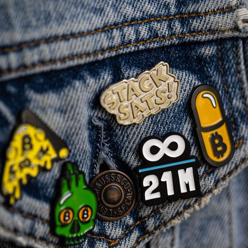 Knut Svanholm Bitcoin Pin with infinity and 21 million motif by artist Kanuto