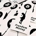 Bitcoin sticker showing Banksy-style girl lifted by Bitcoin balloon symbolizing freedom and hope