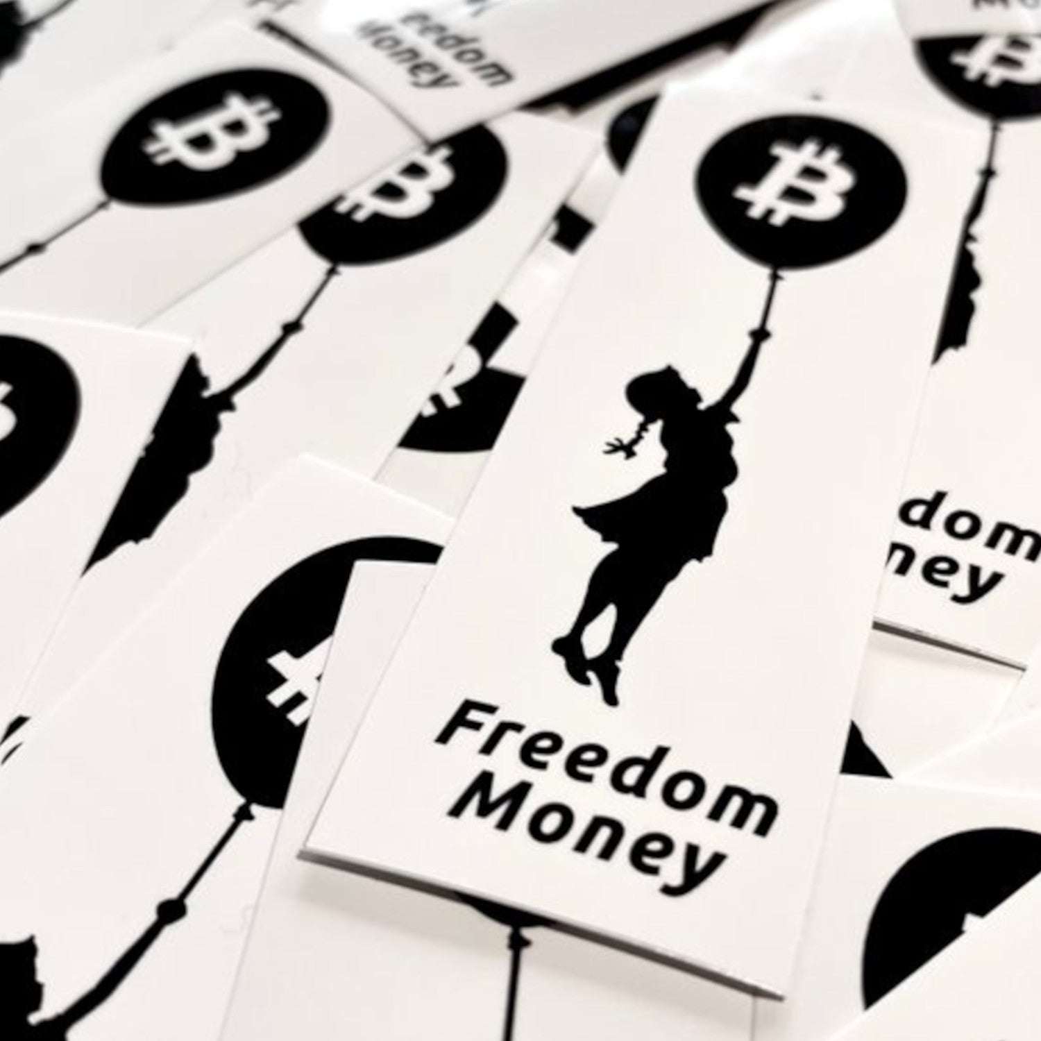 Bitcoin sticker showing Banksy-style girl lifted by Bitcoin balloon symbolizing freedom and hope