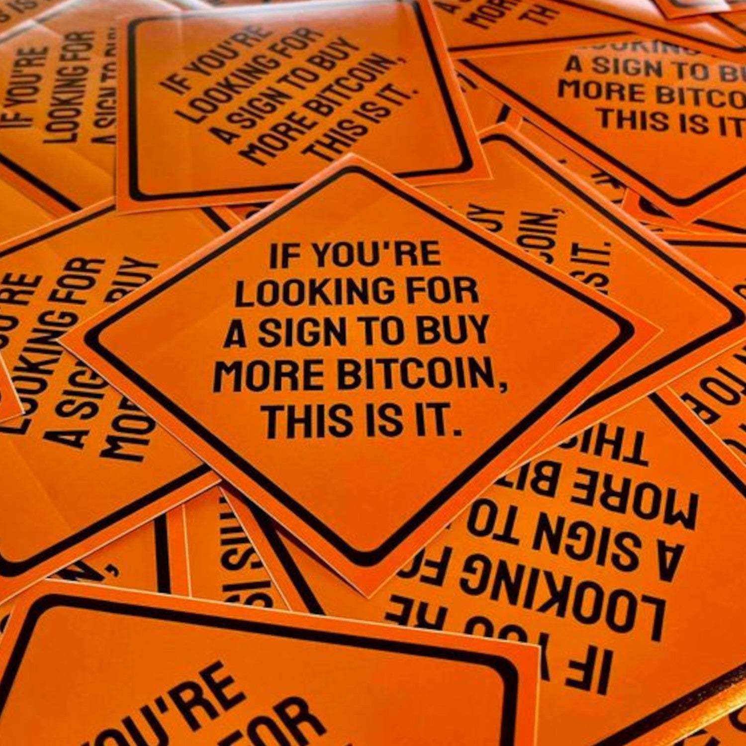 Set of 10 orange Bitcoin stickers styled as American street signs with "buy more bitcoin" message